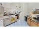 Open-concept kitchen features a mini refrigerator, and plenty of counter space at 4563 Whirlaway Dr # C, Sarasota, FL 34233