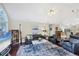 Bright living room with vaulted ceilings, hardwood floors, and lots of natural light at 4563 Whirlaway Dr # C, Sarasota, FL 34233