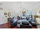 Bright living room with vaulted ceilings, hardwood floors, and lots of natural light at 4563 Whirlaway Dr # C, Sarasota, FL 34233