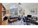 Bright office featuring a large window, computer desk, and comfortable seating area at 4563 Whirlaway Dr # C, Sarasota, FL 34233