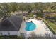 Relaxing pool area with comfortable lounge chairs, landscaping, and a pristine pool at 4563 Whirlaway Dr # C, Sarasota, FL 34233