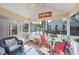 Relaxing screened porch with patio furniture and views of the surrounding landscape at 4563 Whirlaway Dr # C, Sarasota, FL 34233
