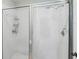 Clean and functional shower featuring white tile and a framed glass door at 4563 Whirlaway Dr # C, Sarasota, FL 34233