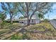 Backyard with large shade tree at 5115 Island Date Way, Sarasota, FL 34232