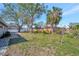 Backyard featuring partial fencing and mature trees at 5115 Island Date Way, Sarasota, FL 34232