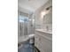 Modern bathroom featuring a sleek vanity, walk-in shower with glass door, and stylish tile flooring at 5115 Island Date Way, Sarasota, FL 34232