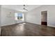 Sunlit bedroom featuring contemporary floors and a large window offering a pleasant outdoor view at 5115 Island Date Way, Sarasota, FL 34232