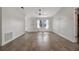 Bright and airy living room with modern tile flooring and large window, perfect for relaxing at 5115 Island Date Way, Sarasota, FL 34232