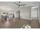 Spacious living room with tile floors and an open layout, seamlessly connecting to the kitchen and dining areas at 5115 Island Date Way, Sarasota, FL 34232