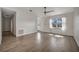 Well-lit living room with stylish floors, a ceiling fan, and a cozy, inviting atmosphere at 5115 Island Date Way, Sarasota, FL 34232