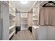 Large walk-in closet with custom shelving and storage solutions at 5115 Island Date Way, Sarasota, FL 34232