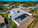 Aerial shot of a home with a screened-in pool and a spacious backyard at 6145 Bonaventure Ct, Sarasota, FL 34243