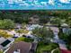Aerial view of a residential neighborhood featuring lush trees and well-maintained homes at 6145 Bonaventure Ct, Sarasota, FL 34243