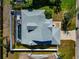 Aerial view of a home with a large screened-in pool and a spacious backyard at 6145 Bonaventure Ct, Sarasota, FL 34243