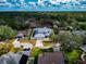 Aerial view of a residential neighborhood featuring lush trees and well-maintained homes at 6145 Bonaventure Ct, Sarasota, FL 34243