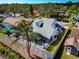 A sunny aerial shot showcases a home with a screened-in pool and well-kept backyard at 6145 Bonaventure Ct, Sarasota, FL 34243
