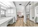 Bathroom featuring a white vanity with stone countertop, mirror, and lighting at 6145 Bonaventure Ct, Sarasota, FL 34243