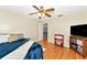Well-lit bedroom with hardwood floors, a ceiling fan, and ample space at 6145 Bonaventure Ct, Sarasota, FL 34243