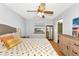 Sunny bedroom featuring a large window, light walls, and wood floors at 6145 Bonaventure Ct, Sarasota, FL 34243