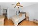 Bedroom includes closet storage, simple decorations, and a modern ceiling fan at 6145 Bonaventure Ct, Sarasota, FL 34243