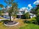 Charming two-story home with mature landscaping, a screened porch, and an attached two-car garage at 6145 Bonaventure Ct, Sarasota, FL 34243