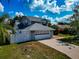 Well-maintained two-story home with a large garage and landscaped front yard under a bright, cloudy sky at 6145 Bonaventure Ct, Sarasota, FL 34243