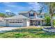 Charming two-story home with a well-manicured lawn, garage, and screened-in porch at 6145 Bonaventure Ct, Sarasota, FL 34243