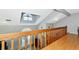 Bright open floor plan design featuring vaulted ceilings and a railing overlooking the floor below at 6145 Bonaventure Ct, Sarasota, FL 34243