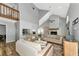 Bright living room with high ceilings, open floor plan, and fireplace feature at 6145 Bonaventure Ct, Sarasota, FL 34243