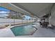 Relaxing screened-in pool with ample seating and lush landscaping offers a private outdoor retreat at 6145 Bonaventure Ct, Sarasota, FL 34243