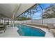 Relaxing screened-in pool with ample seating and lush landscaping offers a private outdoor retreat at 6145 Bonaventure Ct, Sarasota, FL 34243