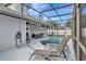Inviting screened-in pool area with lounge chairs and dining offers great space for outdoor entertainment at 6145 Bonaventure Ct, Sarasota, FL 34243