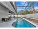 Relaxing screened-in pool with ample seating and lush landscaping offers a private outdoor retreat at 6145 Bonaventure Ct, Sarasota, FL 34243