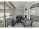 Cozy screened-in porch with comfortable seating, perfect for relaxing outdoors at 6145 Bonaventure Ct, Sarasota, FL 34243