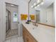 Bathroom featuring a vanity with a large mirror and walk-in shower at 641 Verrocchio Dr, Nokomis, FL 34275