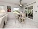 Bright eat-in kitchen with tile flooring and sliding doors to lanai at 641 Verrocchio Dr, Nokomis, FL 34275