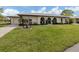Charming single-story home with a well-manicured lawn and arched entryway at 641 Verrocchio Dr, Nokomis, FL 34275