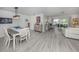 Open-concept living and dining area with sleek floors and stylish furnishings at 641 Verrocchio Dr, Nokomis, FL 34275