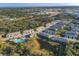 Community aerial view showcasing townhomes, landscaping, pool and surrounding area at 6634 Calypso Coral Ln, Sarasota, FL 34240