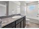 Bathroom featuring a granite countertop vanity, toilet, tub, and shower combo at 6634 Calypso Coral Ln, Sarasota, FL 34240