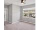Bright bedroom with a ceiling fan and large window at 6634 Calypso Coral Ln, Sarasota, FL 34240