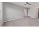Bedroom with neutral paint and carpet and featuring multiple doorways at 6634 Calypso Coral Ln, Sarasota, FL 34240