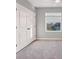 Bedroom featuring carpet and large window that allows ample natural light at 6634 Calypso Coral Ln, Sarasota, FL 34240