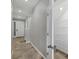 Entryway leading to a staircase, with an opened coat closet to the right at 6634 Calypso Coral Ln, Sarasota, FL 34240