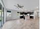Modern kitchen featuring stainless steel appliances, granite countertops, and a large island at 6634 Calypso Coral Ln, Sarasota, FL 34240