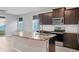 Bright kitchen features a marble kitchen island with a stainless steel sink at 6634 Calypso Coral Ln, Sarasota, FL 34240