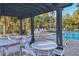 Beautiful community pool offers shaded seating areas for residents to relax by the poolside at 6634 Calypso Coral Ln, Sarasota, FL 34240