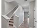 Hallway with a stairway leading to the second floor at 6634 Calypso Coral Ln, Sarasota, FL 34240