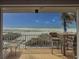 Enjoy the beach view from this cozy balcony with comfortable seating and ocean breezes at 6701 Gulf Of Mexico Dr # 311, Longboat Key, FL 34228