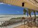 Breathtaking ocean view from the cozy balcony with seating and a dining area at 6701 Gulf Of Mexico Dr # 311, Longboat Key, FL 34228